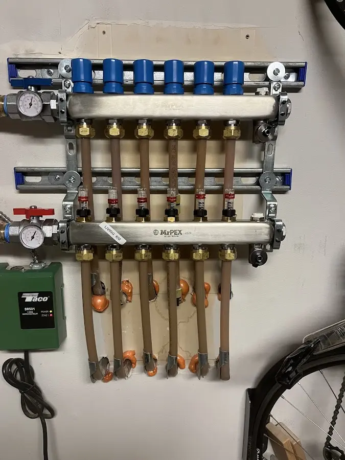 Plumber performing Water Heater Repair at a residential property in Green